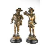 A pair of 19th/20th century figures of cavaliers.