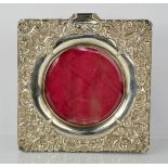 A Victorian silver embossed photograph frame,16 by 15cm.