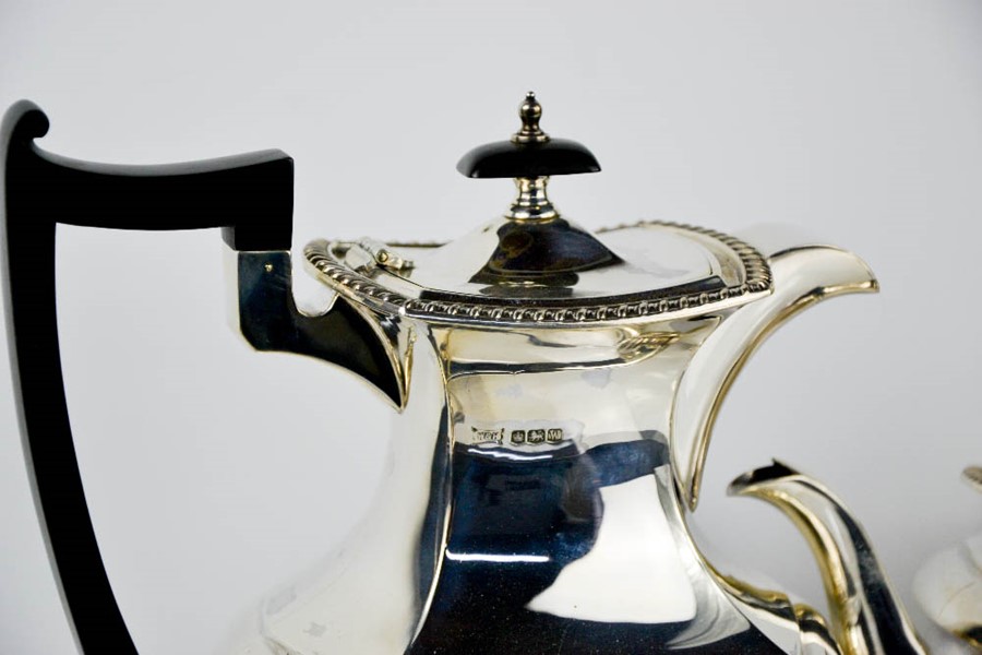 A silver tea service comprising tea pot, hot water pot, sugar bowl and milk jug, Sheffield 1964, - Image 3 of 3