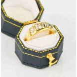 A gold (untested) and diamond ring, set with four old cut diamonds, size M, 6.3g.