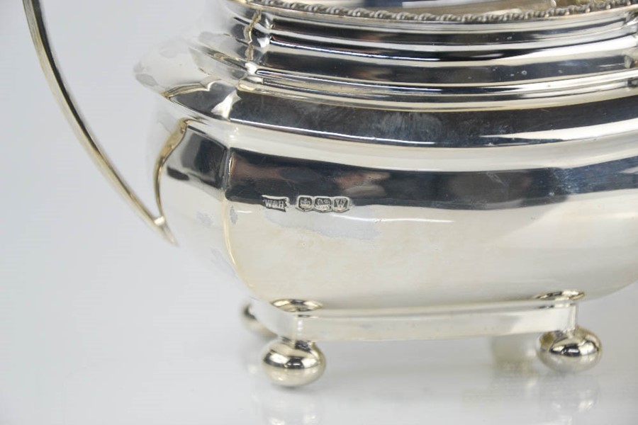 A silver tea service comprising tea pot, hot water pot, sugar bowl and milk jug, Sheffield 1964, - Image 2 of 3