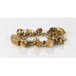 A 9ct gold charm bracelet. 62.3g