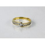 An 18ct yellow gold [tested] contemporary diamond ring total diamond weight 0.35ct, Size M, 2.5g