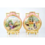 A pair of Royal Worcester moon flask vases, the japanesque bodies painted with rustic scenes of