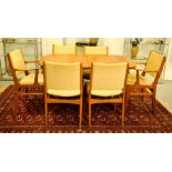 A mid century D-Scan Danish teak dining suite comprising table and six chairs.