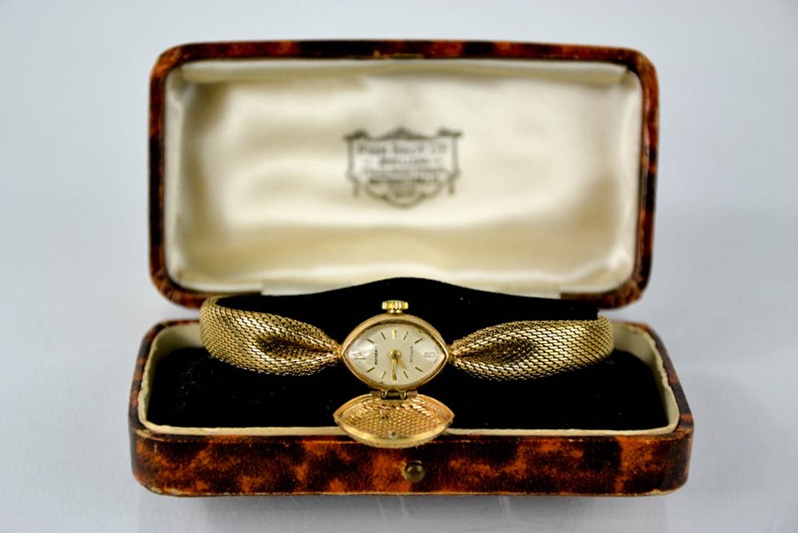 A 9ct gold Rotary ladies wristwatch with 9ct gold strap and dial guard, 19.7g.