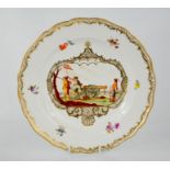 A Meissen 19th century hand-painted plate depicting men loading a cannon - 24.5cm