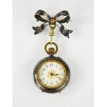 A 19th century silver ladies pocket watch with bow form brooch to the top, an arabic dial and