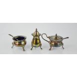 A silver cruet set, comprising salt, mustard and pepper, with blue glass liners, including two