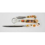 A Royal Crown Derby bottle opener, a letter opener and cheese knife.