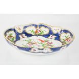 An 18th century Worcester bowl, painted with exotic birds and insects on a cobalt blue ground,