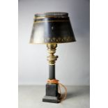 An early 20th century American style black painted lamp.