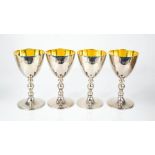 A set of four silver goblets, with gilded interiors, London 1979, 32toz.