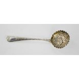 A silver sifter spoon, London 1735, the bowl embossed with flowers, and birds.