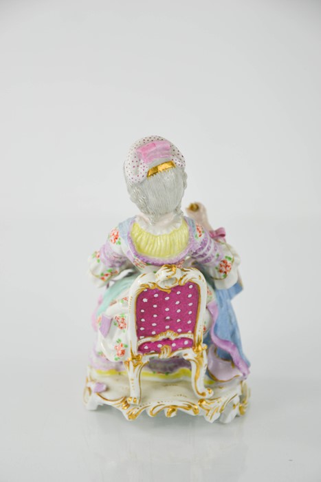 A Meissen porcelain figure of a seated lady holding a clam shell, together with a Sitzendorf - Image 5 of 7