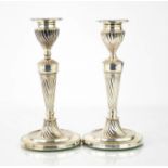 A pair of Victorian silver candlesticks, with beaded edge, fluted columns, Sheffield 1886 by