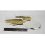 A Sterling silver mirror, brush and comb set.