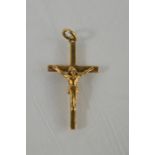 A 9ct yellow gold crucifix and Christ pendant - 1.7g
