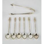 A set of six white metal apostle spoons together with a pair of silver sugar tongs - 2.25toz