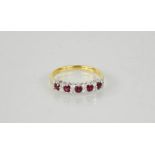 An 18ct yellow gold, ruby and diamond ring, size O, 3.3g.