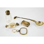 A silver vinaigrette, silver box in the form of a sweet, a white metal spoon, magnifier and silver