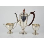 A silver three piece coffee set.