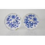 A pair of blue and white EWM&Co Meissen dishes depicting flowers, 14cm diameter. A/F