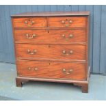 A 19th century Victorian mahogany chest of drawers, two over three long graduated drawers, raised on