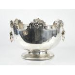 A 19th century silver plate punchbowl, with lion head handles and face masks 22cm high, 32cm