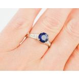 An 18ct white gold blue sapphire 1.86ct and diamond 0.15ct, ring, size M, 3.7g.