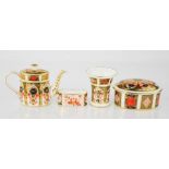 A Royal Crown Derby teapot, trinket box and cover, watering can and napkin ring in the Imari