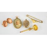 A 19th century citrine spinner fob, a pendant locket 9ct gold cufflink, and silver locket.