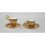 Two Royal Crown Derby coffee cans and saucers, both 2451 to the base.