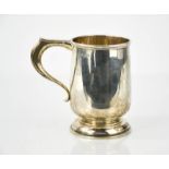 A silver tankard, Birmingham 1928, Alfred from Henry engraved to the base, 9.41toz.
