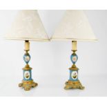 A pair of 19th century French Sevres style porcelain and gilt metal mounted lamps, 33cm high.