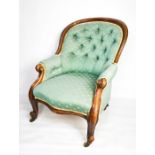 A Victorian spoon back mahogany chair in green upholstery.