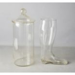 A large glass drinking boot, and a glass jar and cover