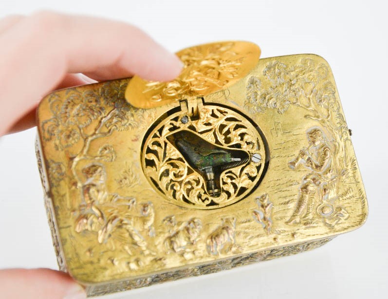 A 19th century French singing automaton bird musical box, the brass box cast with cherubs and - Image 2 of 2