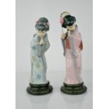 A pair of Lladro porcelain geisha girls.