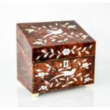 A 19th century tortoiseshell and mother of pearl inlaid tea caddy with bone carved bun feet, 15 by
