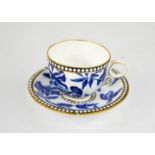 A Coalport cup and saucer, in the blue bird pattern.