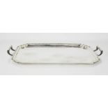 A silver rectangular tray with handles, scroll corners, Sheffield 1935, 47 by 28cm, 44toz.