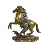 A 19th century bronze by Colston, horse and handler, 57 by 57cm.