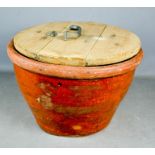A stoneware pippin with wooden lid