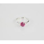 An 18ct white gold pink sapphire and diamond ring, the sapphire 1.20ct, and the diamonds totalling