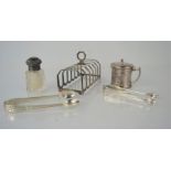 A silver toast rack, Birmingham 1968 together with a silver mustard pot, and two silver sugar tongs.