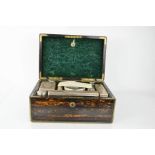 A Victorian coromandel dressing table / vanity box, with a fitted interior containing glass and