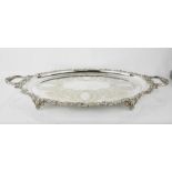 A large silver plated tray, with embossed scrollwork edge and engraved with decoration, 71cm x 45cm