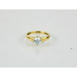A 14ct gold and moissanite ring, 2.4g.
