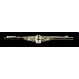An Art Deco diamond bar brooch, the oval cut diamond approximately 1.5cts; 7 by 5mm, 6cm long, 4.